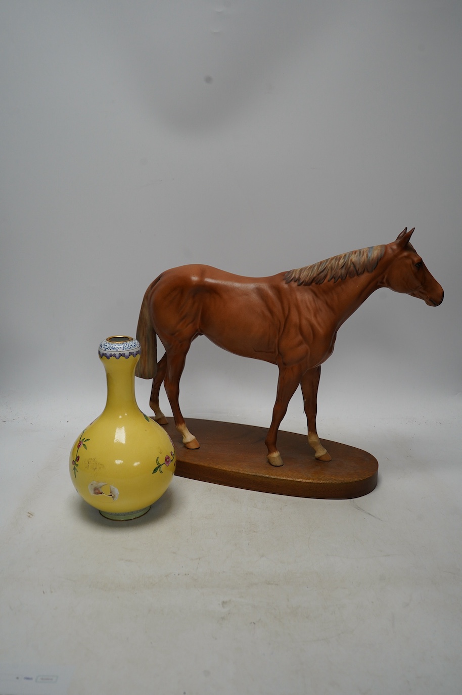 A Royal Doulton horse, ‘Grundy’, and a Chinese enamel on copper vase. Condition - poor to fair